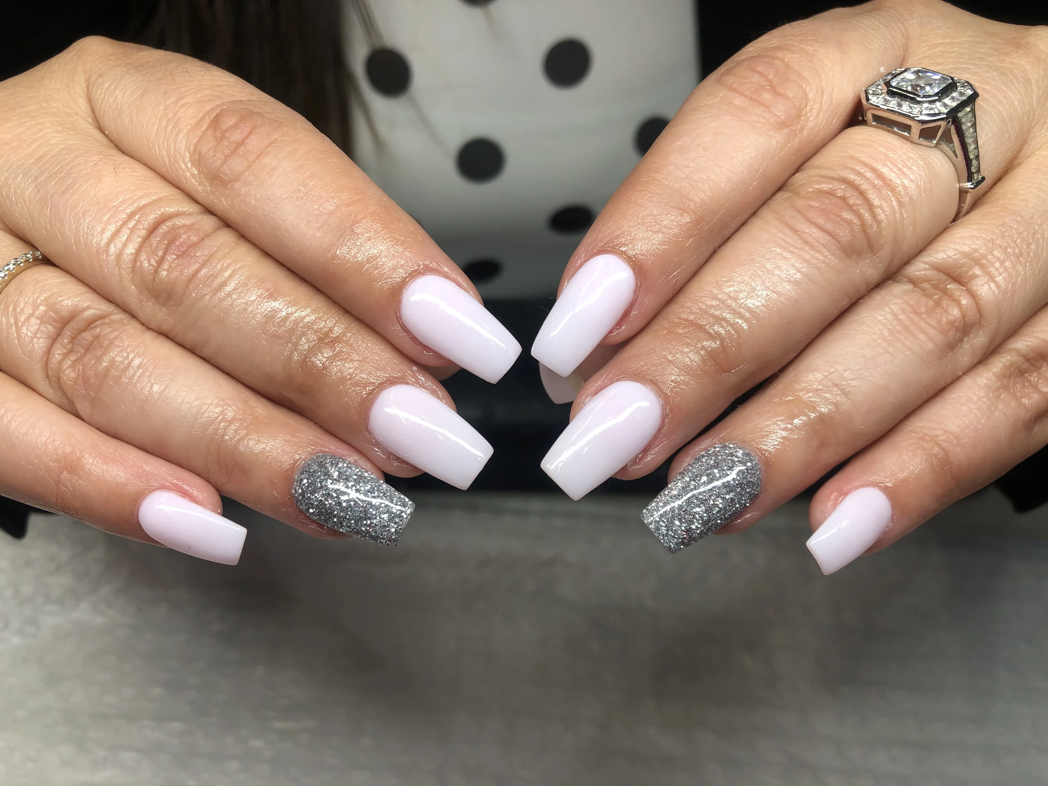 Milky-pink coffin nails with silver-glitter accent nails
